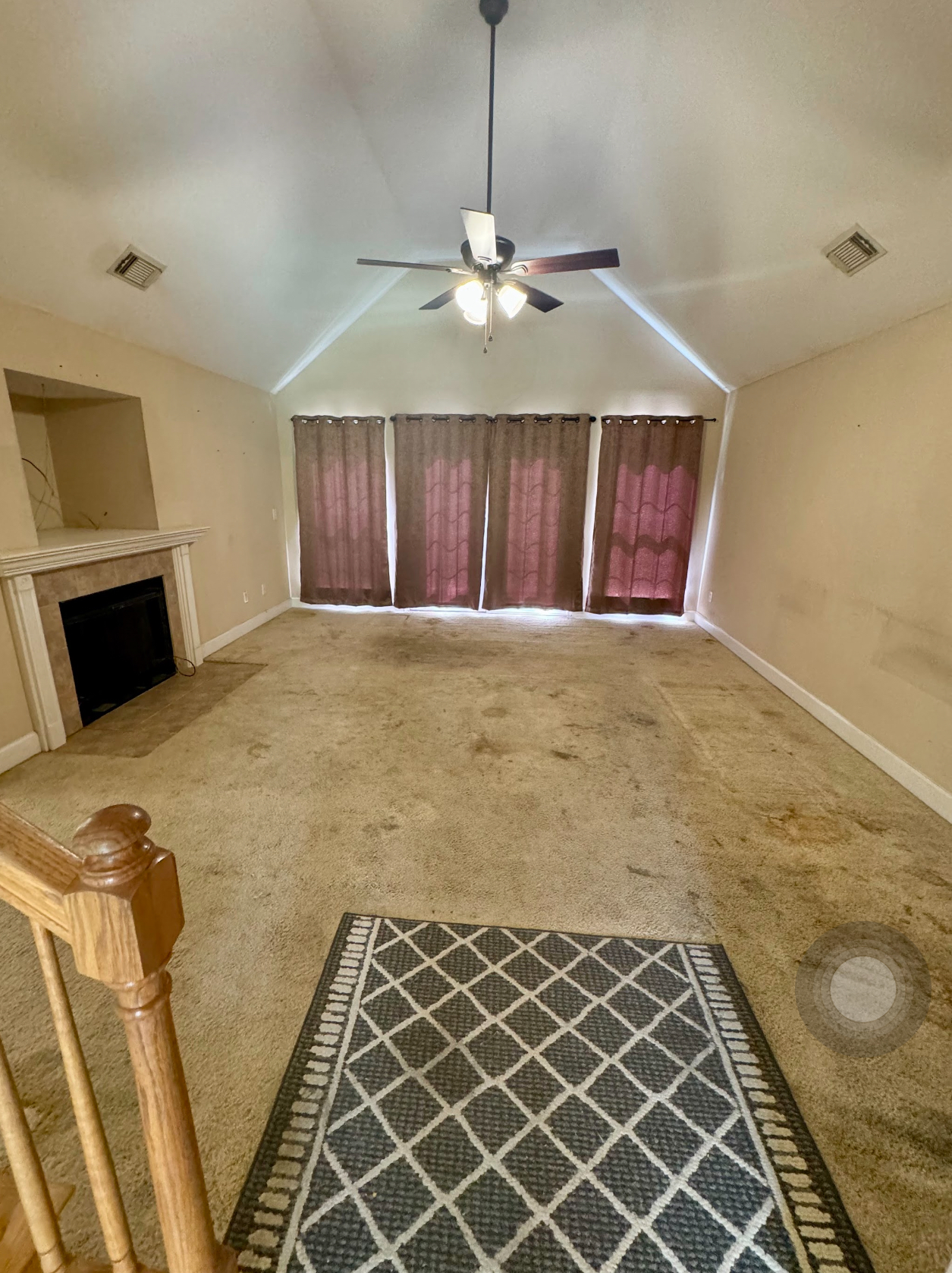 Tuscaloosa, AL — before Upland renovation, with stained carpet and dated finishes